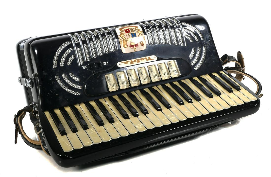 Vintage 1950's Noble Keyboard Accordion: Made in Italy in the 1950’s, this Noble piano style keyboard accordion has 41 full-size keys, 7 treble shifts with a master switch, 120 bass buttons, and 3 bass shifts. Other features include a soun