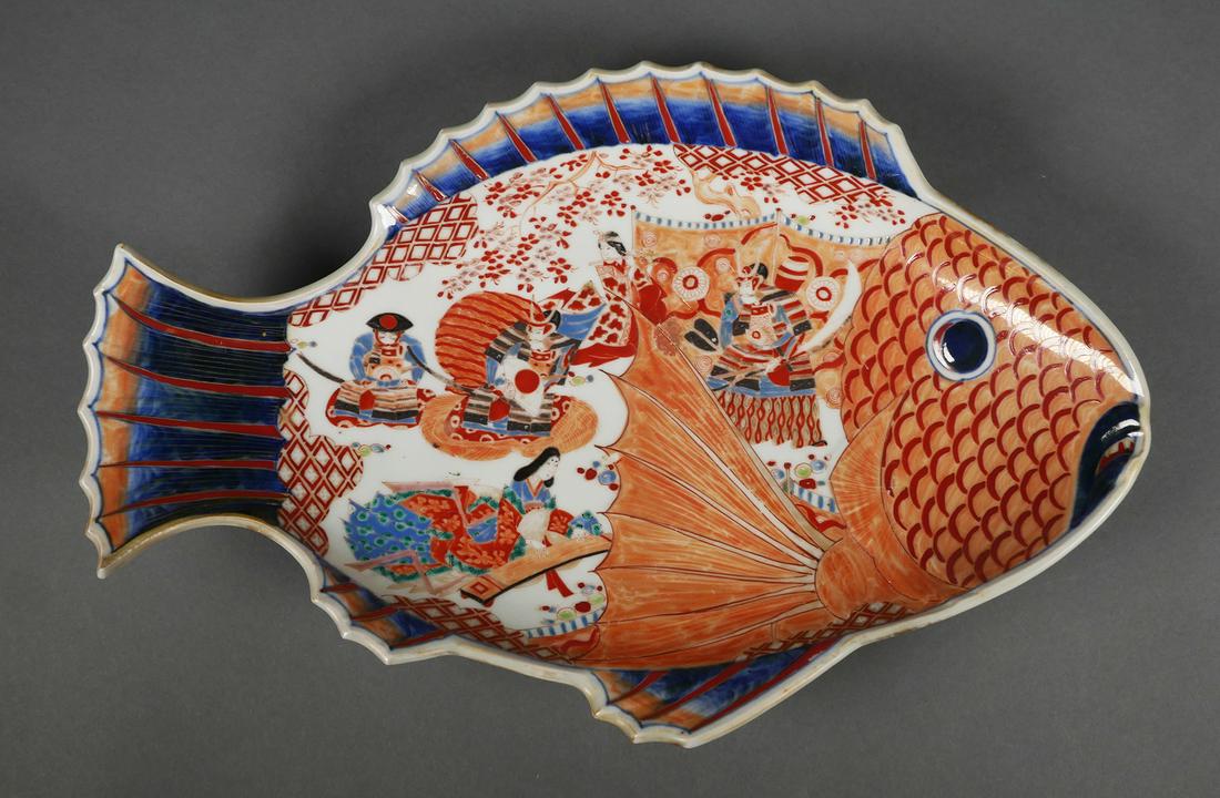 Signed Japanese Imari Porcelain Fish Form Platter: Antique Japanese Imari porcelain fish form platter. Decorated with three samurai warriors and two woman, six-character mark on bottom. Serving tray measures approx. 15 1/2" long x 10" wide. No cracks,