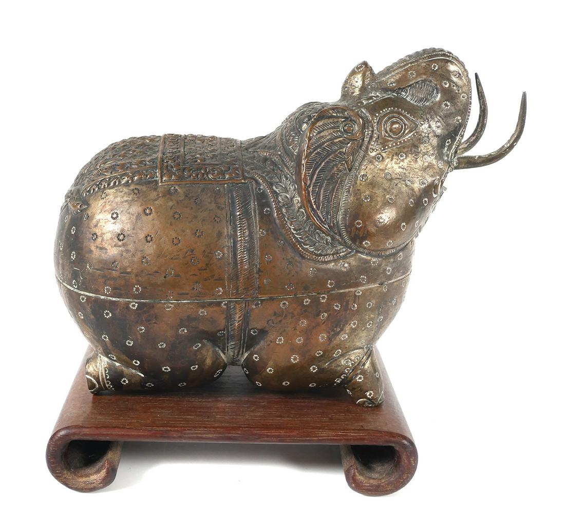 Cambodian or Burmese Elephant Betel Box: Likely Burmese, Cambodian or South East Asia large handmade silvered figural elephant betel nut container or trinket box with wood stand. Repousse and chased details. According to the consignor the bo