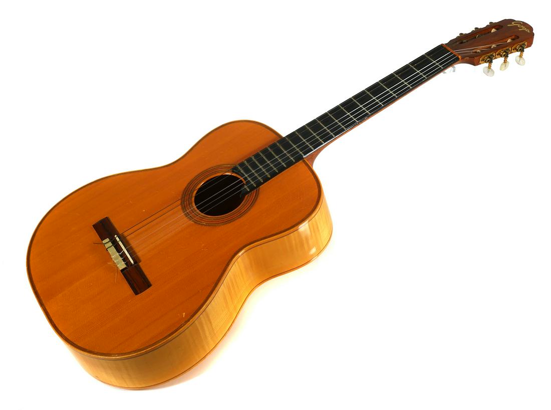1970 Goya G-30 Classical Acoustic Guitar: Vintage Goya G30 classical acoustic guitar with mahogany body and ebony neck. Serial #4053024. Missing one string, minor wear and scratches on body, some cracks in varnish, see photos. Hard-shell case