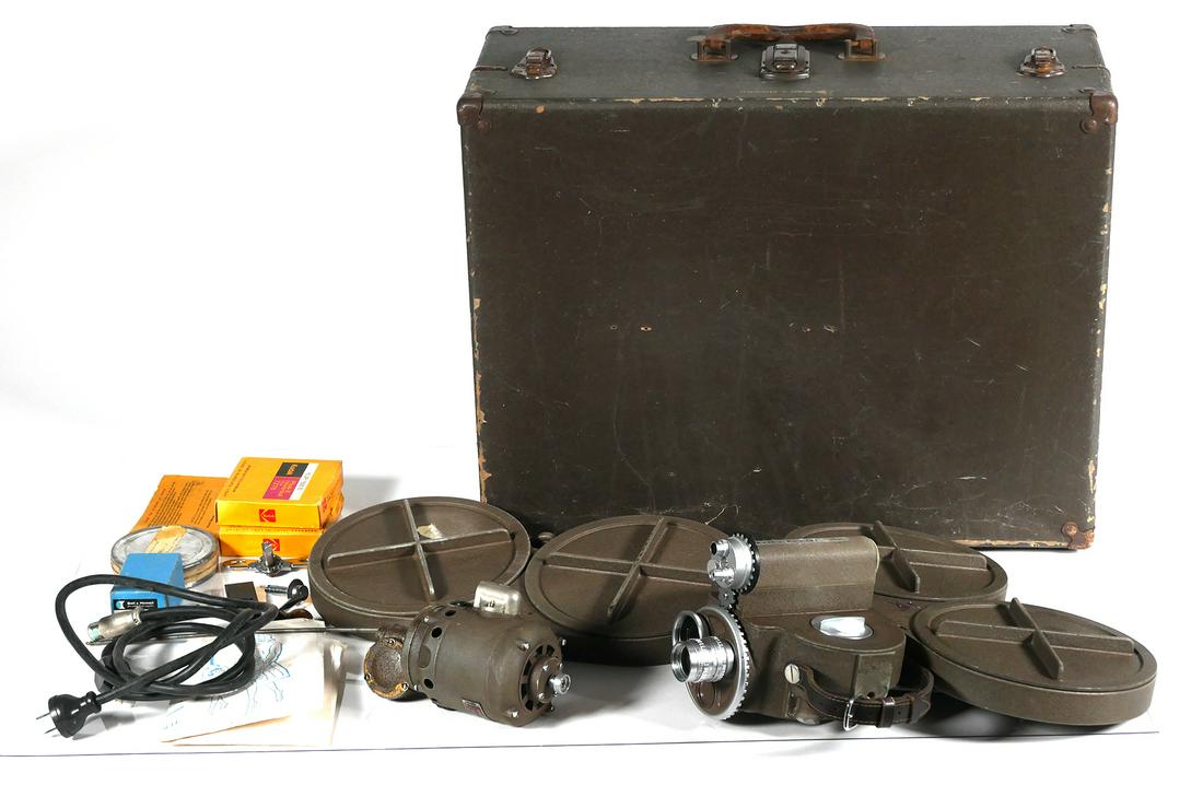 Bell and Howell 70HR 16mm Movie Camera: Circa 1955, Bell & Howell 70-HR 16mm motion picture camera with B&H Super Comat 1" f1.9 lens. Included with camera is an external motor drive with power cord, additional 400ft. film magazine, winding