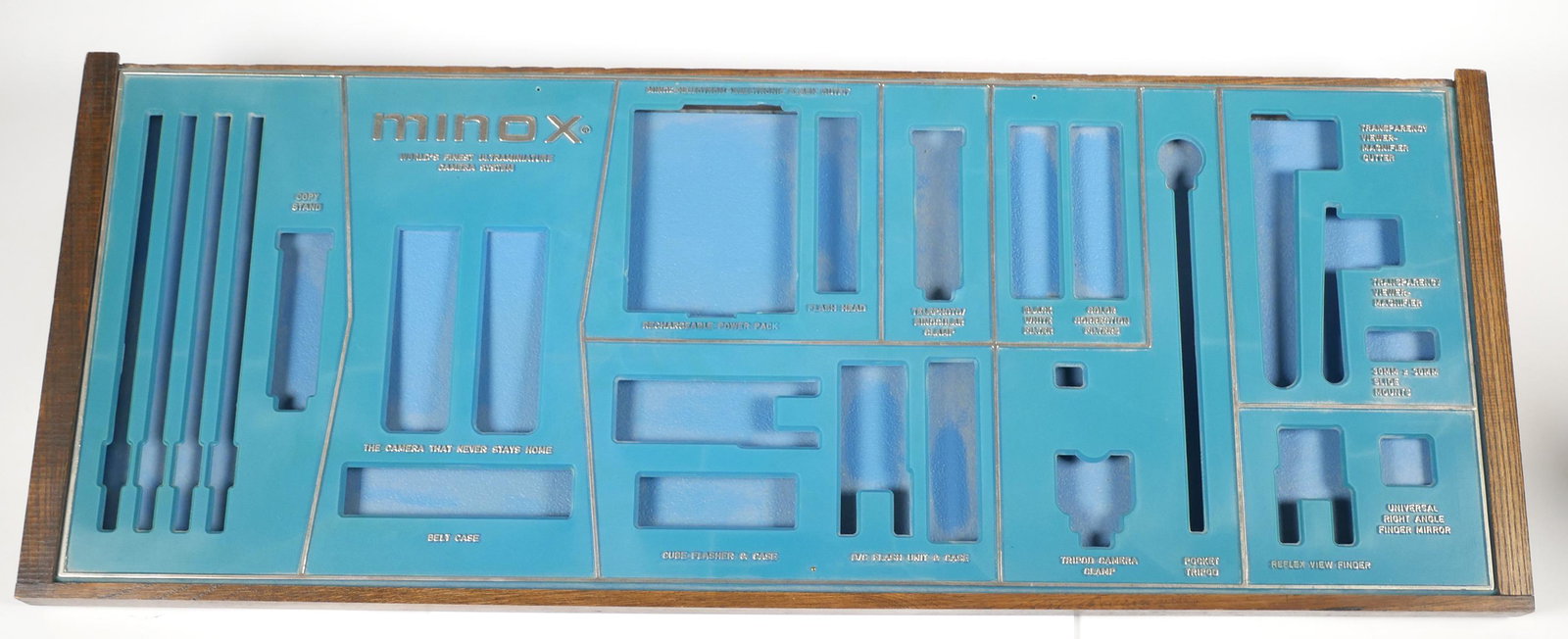 Vintage Minox Camera Shop Dealer Display: Minox 1960's dealer display tray. This advertising tray was designed to display nearly the entire line of Minox B cameras and accessories available during the 1960s. Tray measures 27 1/2" long x 10 5/