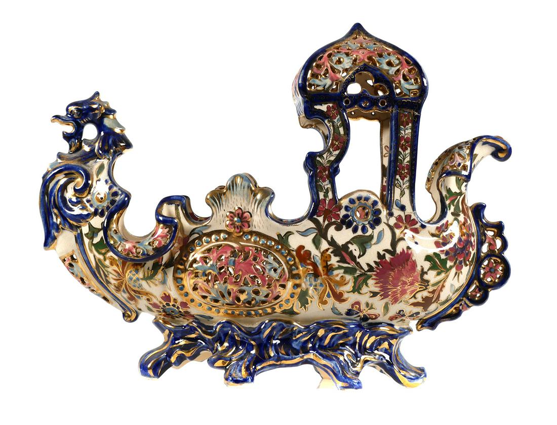 Fischer J Budapest Reticulated Pottery Vase: Antique Hungarian boat form vase or footed bowl with dragon figurehead. Centerpiece measures approx. 12 1/2" long x 10" tall x 4 1/2" wide. Top canopy has been repaired. Crazing present.