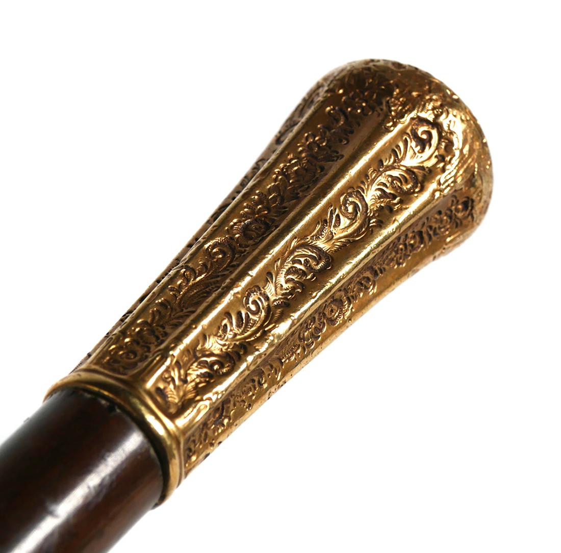 Antique Victorian Gold Handle Walking Cane: Antique Victorian gold topped handle walking cane. Slim 8 sided hand chased knob, 2 1/4" long. Cane measures approx. 34 1/4" long. Handle is inscribed "H.B. Curtis Esq. from his son" with his initals.