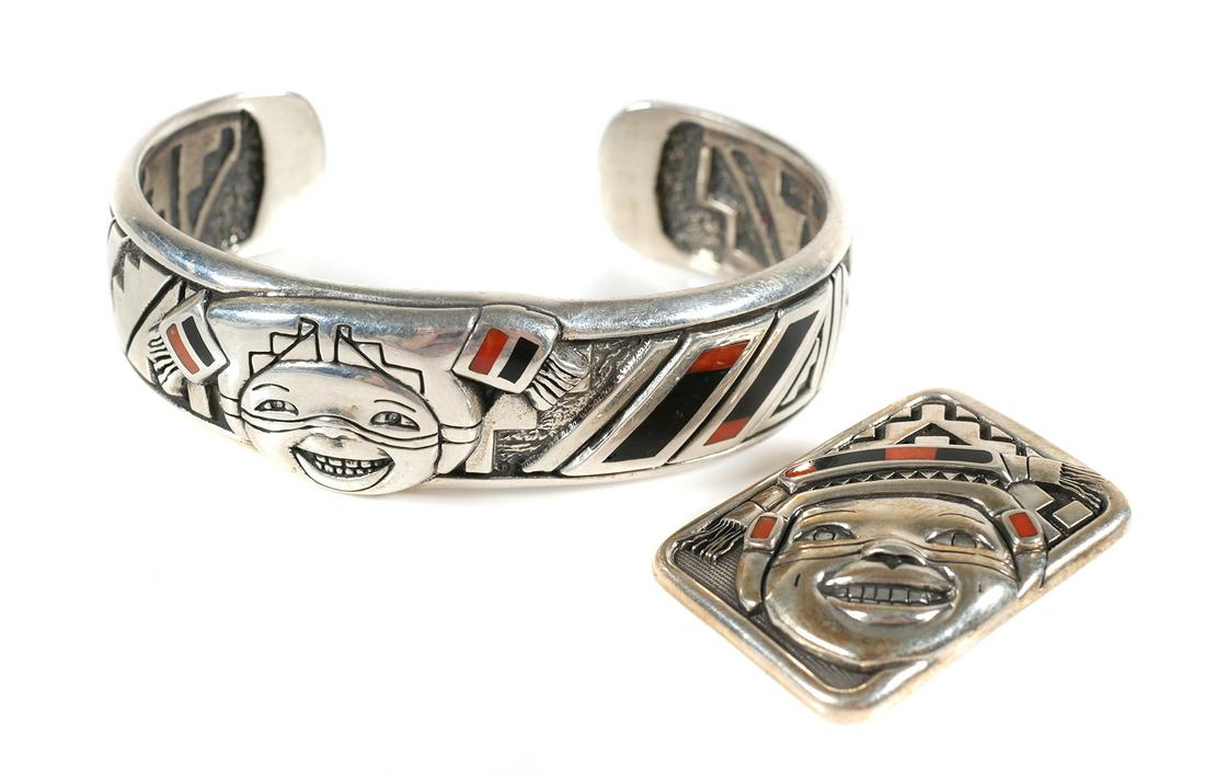 Sterling Native American Cuff Bracelet & Pendant: Matching sterling silver, coral and onyx cuff bracelet and necklace pendant. Both pieces signed by Pueblo artist Kathleen Wall. Pendant measures approx. 1" x 1 1/4", cuff bracelet has 1" gap and insid
