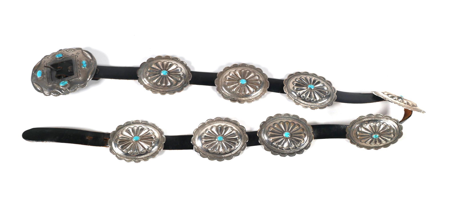 Sterling Silver Turquoise Concho Belt: Leather belt with 8 sterling silver oval conchos and matching buckle. Belt is marked "Genuine Cowhide 32". Conchos measure approx. 2 3/4" x 2 1/8". Overall weight is approx. 292.7 grams. Please check 