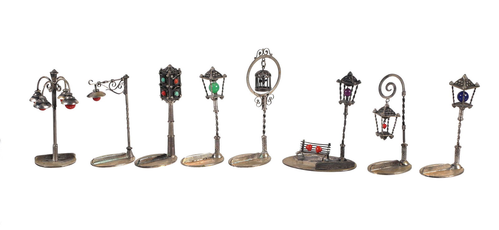 (8) Italian 800 Silver Street Light Card Holders: Collection of 8 miniature street light or lantern place card holder in .800 silver. All have Italian hallmarks. Tallest light measures approx. 3 1/4" tall. Overall weight is 117.9 grams.