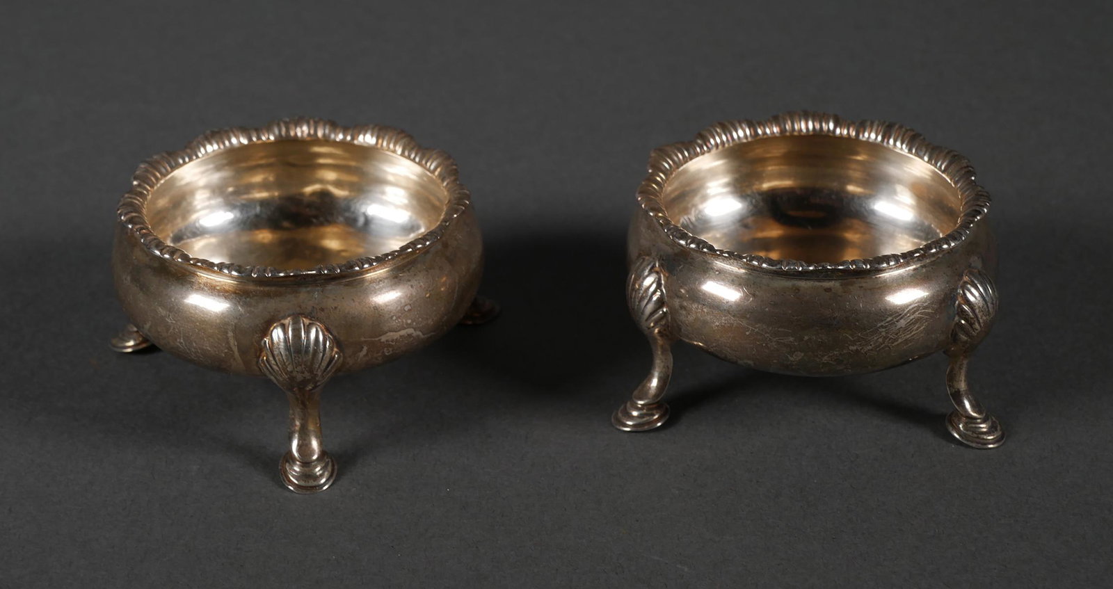Antique Pair English Sterling Salt Cellars: Pair sterling silver salts with London 1767 hallmarks. Salts measure approx. 2 1/2" in diameter x 1 1/2" tall. Overall weight 112.7 grams.