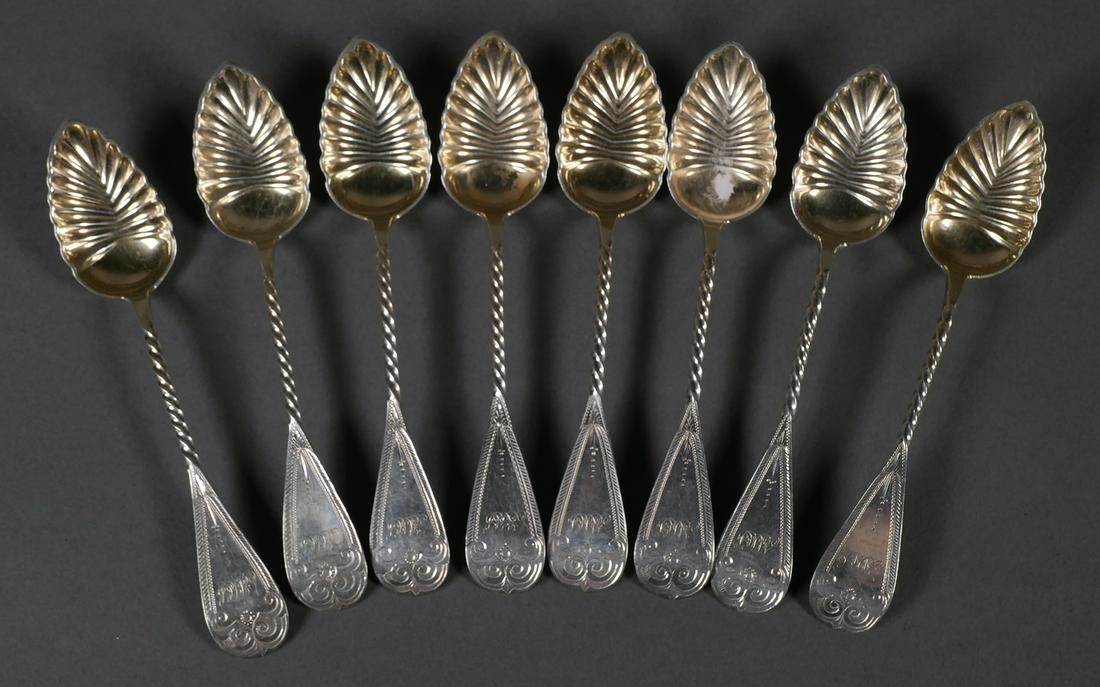 (8) R & W Wilson Berry Desert Spoon: Set of eight American R&W Wilson coin silver spoons. Scalloped gold washed bowls with twisted handles. Spoons measure 5 3/4" long, overall weight 125.4 grams. Monogrammed.