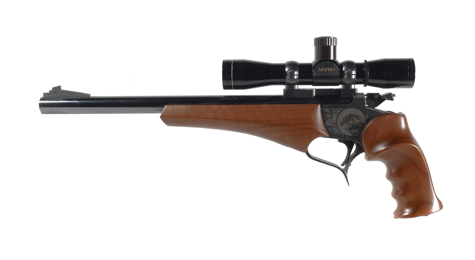 Firearm: Thompson Center Super 14 357 Rem Pistol: Thompson Center Arms Contender Super 14, single shot pistol, in .357 Rem Max caliber. Approx. 14" barrel with clean bore. Very light wear to the exterior finish. Pistol is topped with a M8-4x Leupold 