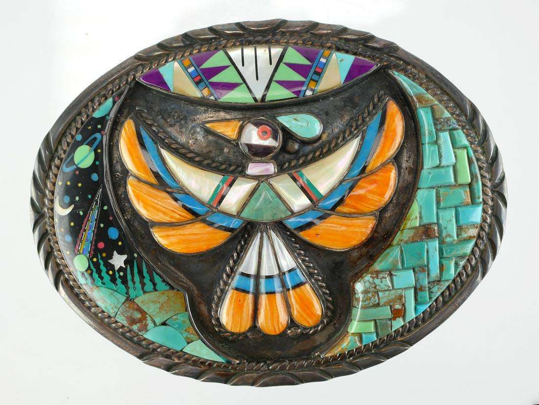 Sterling Turquoise Coral Onyx Inlay Belt Buckle: Native American style sterling silver oval belt buckle featuring a thunderbird with turquoise, MOP, and onyx multi-color inlay. The cosmos micro inlay design depicts planets, stars and moon. Marked St