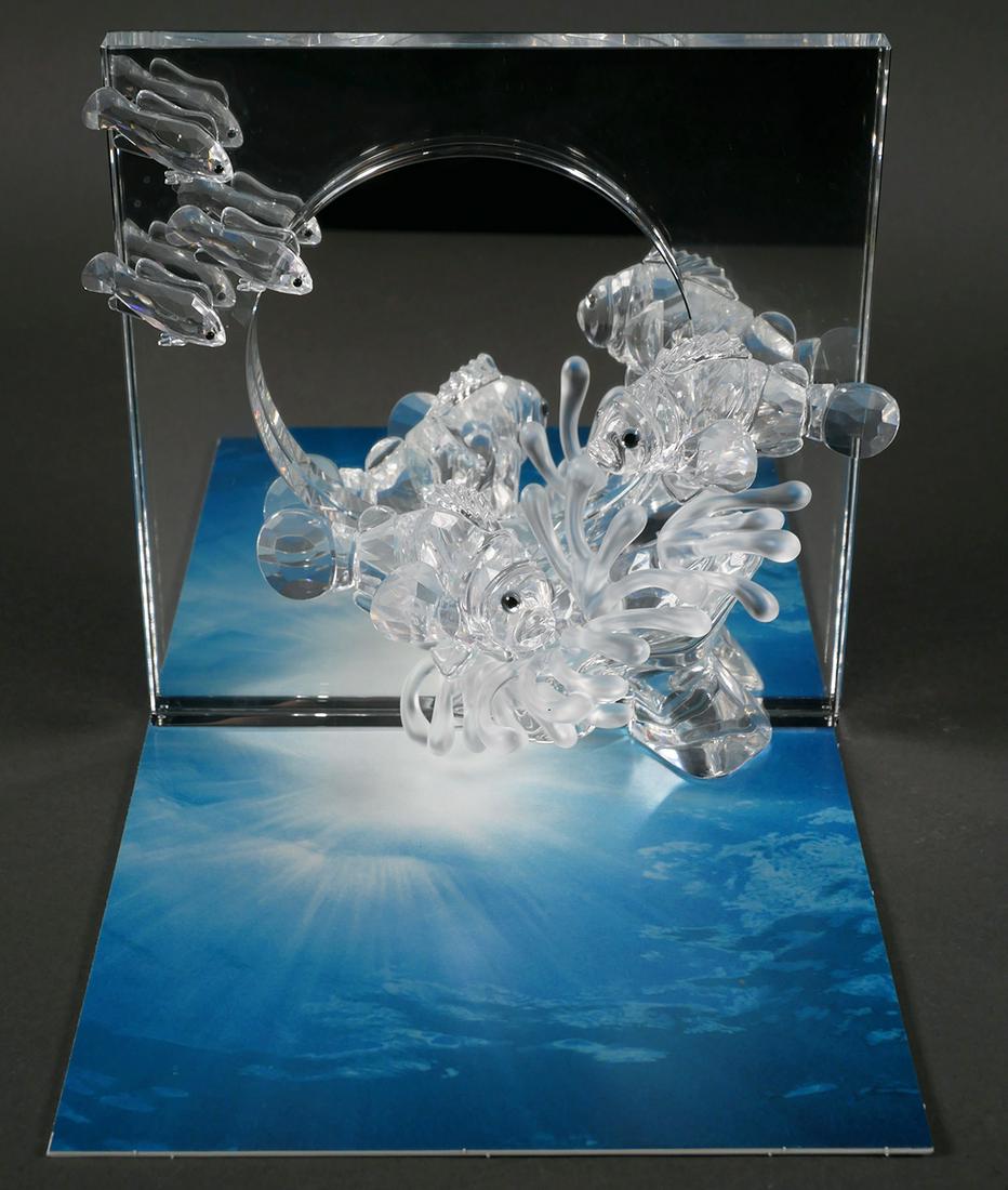 Swarovski Crystal Wonders of the Sea Harmony: Swarovski Crystal Society "Wonders of the Sea Harmony" glass sculpture. 7 1/2" x 8 1/4" x 2 3/4". Box, certificate, mirror base and instructions are included. No chips, cracks or repairs.