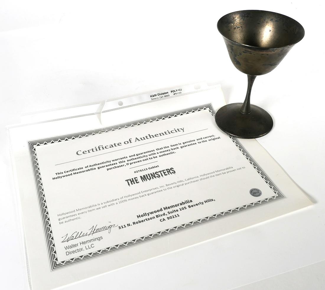 MUNSTERS Prop Goblet Screen Used: The Munsters television show silverplate goblet prop. Comes with COA from Hollywood Memorabilia. Goblet measures approx. 5" tall. This item can be shipped in-house.