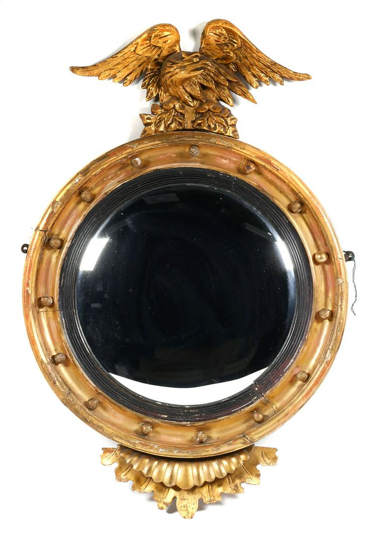 Federal Bullseye Wall Mirror w Eagle: Antique early gilt carved Federal mirror. Measures about 34" high, mirror about 15" diameter. This item will need to be shipped by a packing company of your choice. We maintain a list of reliable ship