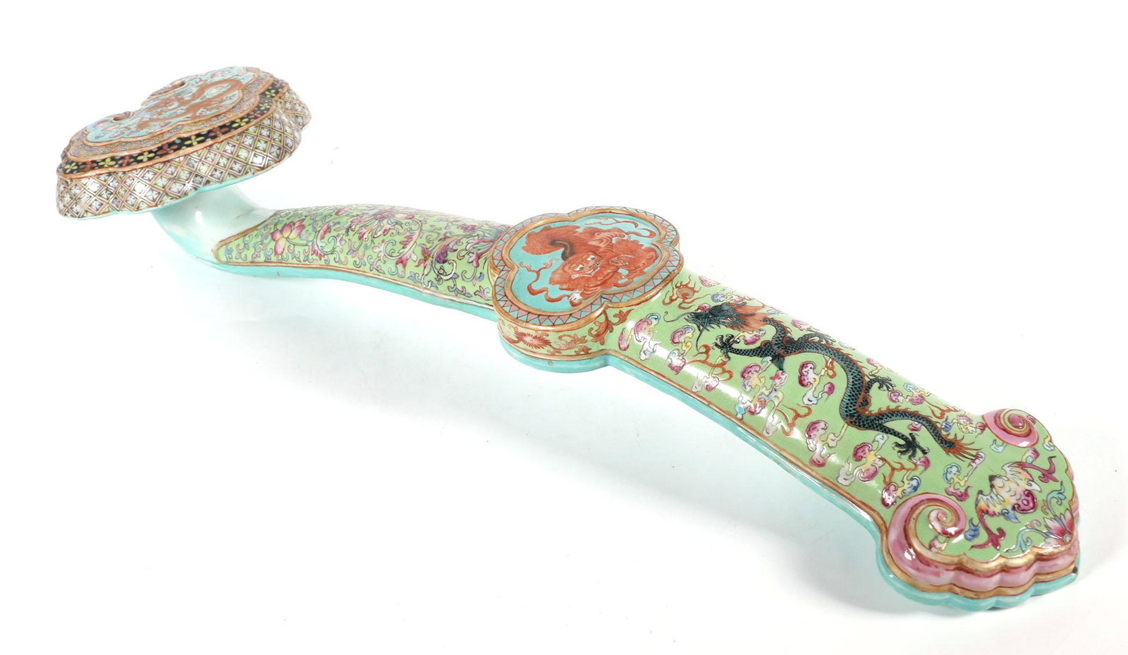 19" Chinese RUYI Scepter Famille Rose Porcelain: Chinese ceramic Famille Rose ruyi or scepter with dragon, lion and floral designs, measures 19 x 5 1/2 inches. This item will need to be shipped by a packing company of your choice. We maintain a list