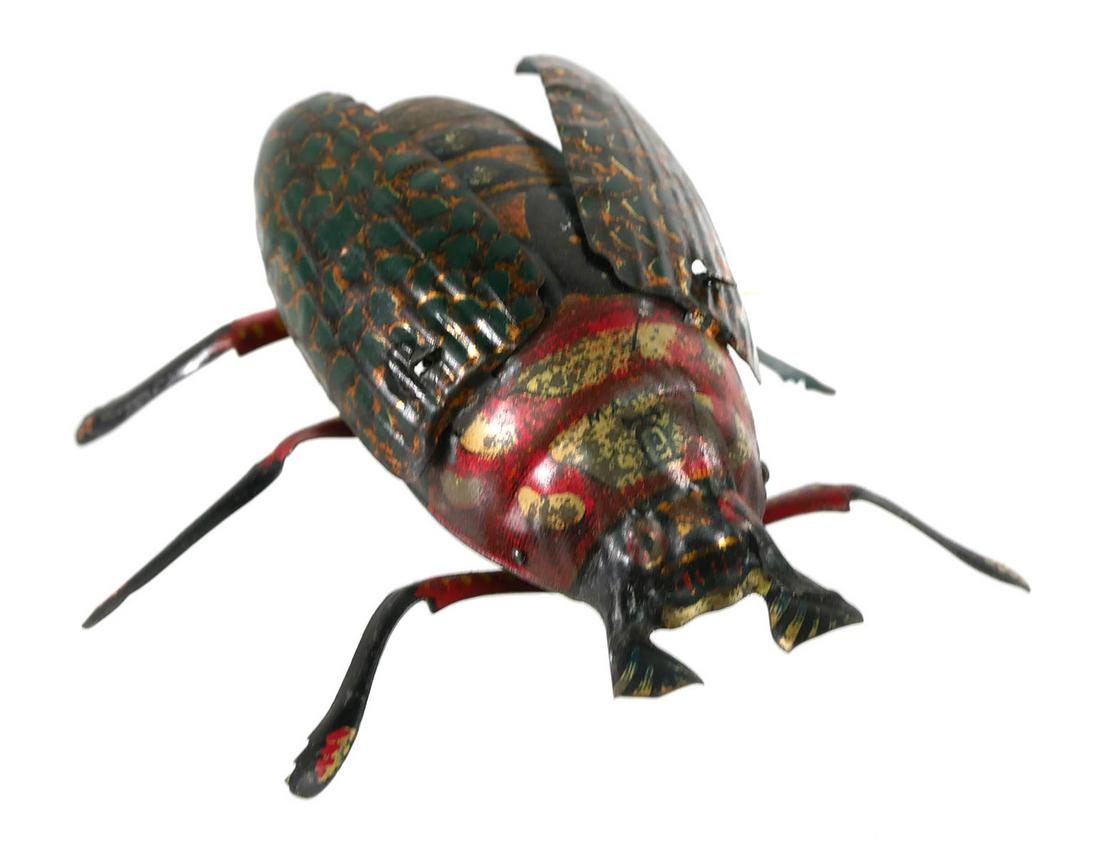 Antique Lehmanns Crawling Beetle Windup Toy: Antique crawling beetle tin lithographed windup toy no. 431 by Lehmanns toy company, Germany, measures 2 x 4 x 4 inches, with original box and label. This item can be shipped in-house.
