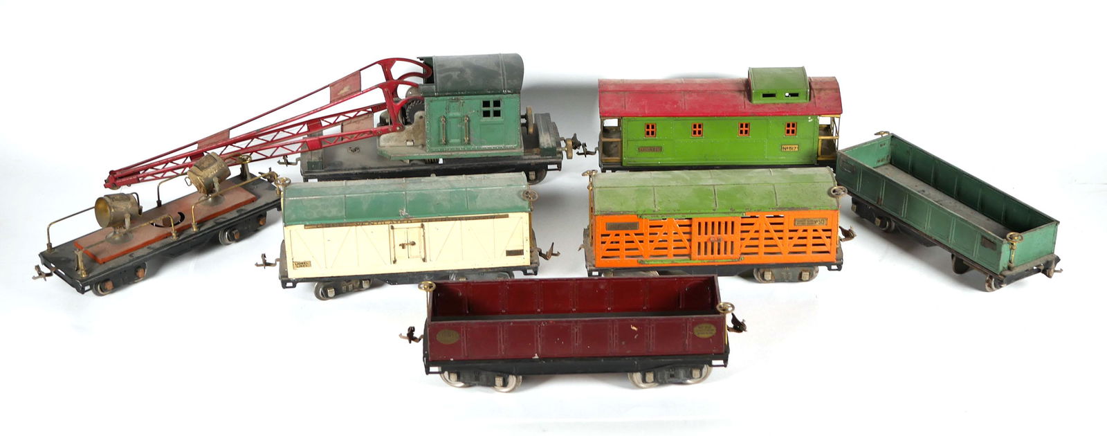 Lionel Lines Standard Gauge Train Set: Set of seven Lionel Lines toy train cars including observation car no. 517, cattle car no. 513, Ventilated Refrigerator no. 514, trailer car no. 512, trailer car no. 212, Light car no. 520, and crane