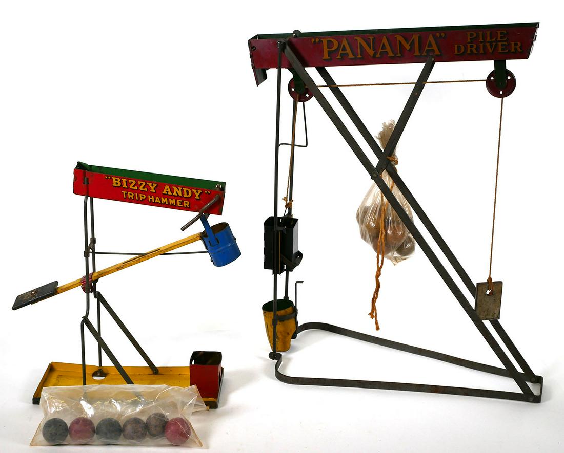 Antique Marble Games: Two tin lithograph toys including Wolverine Bizzy Andy Trip Hammer 1920s Marble Toy and Panama Pile Driver marble game 1905. Panama measures 17 inches high. This item will need to be shipped by a pack