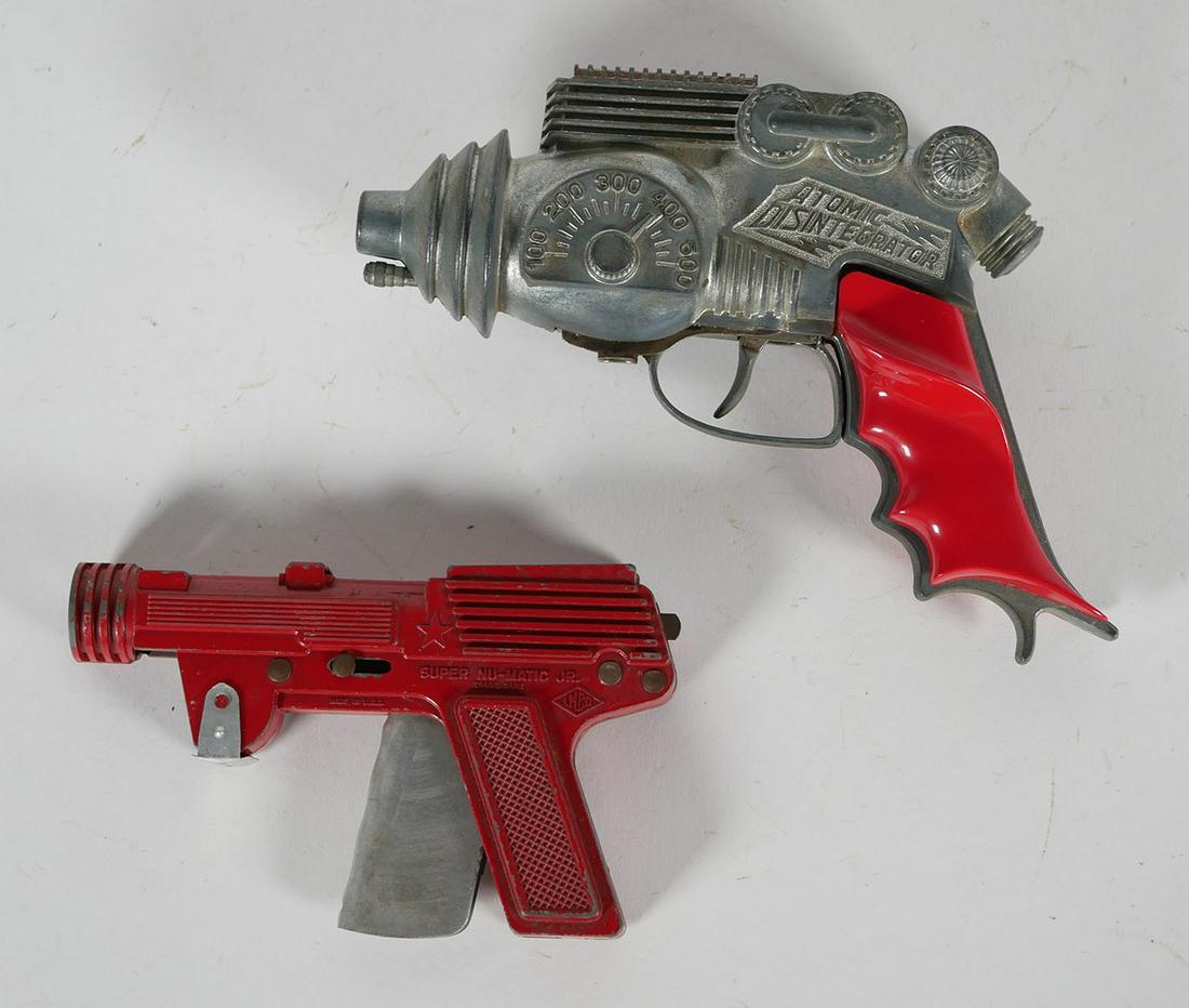 LMCo & Hubley Toy Pistols: Vintage diecast Super Nu-Matic Jr. Paper Buster gun and Hubley Atomic Disintegrator repeating cap pistol. This item can be shipped in-house.