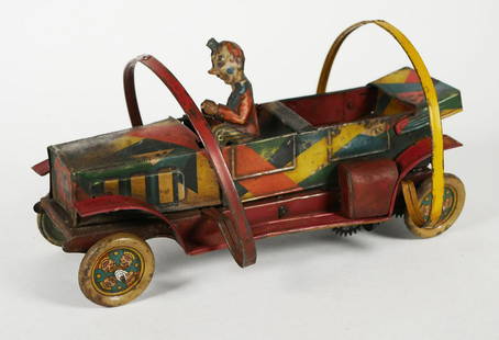 Hans Eberl Tin Wind-up Topsy Turvy Tom Clown: German tin litho windup toy car with original clown driver, measuring 10 inches in length, marked on back D.R.P. ang. This item can be shipped in-house.