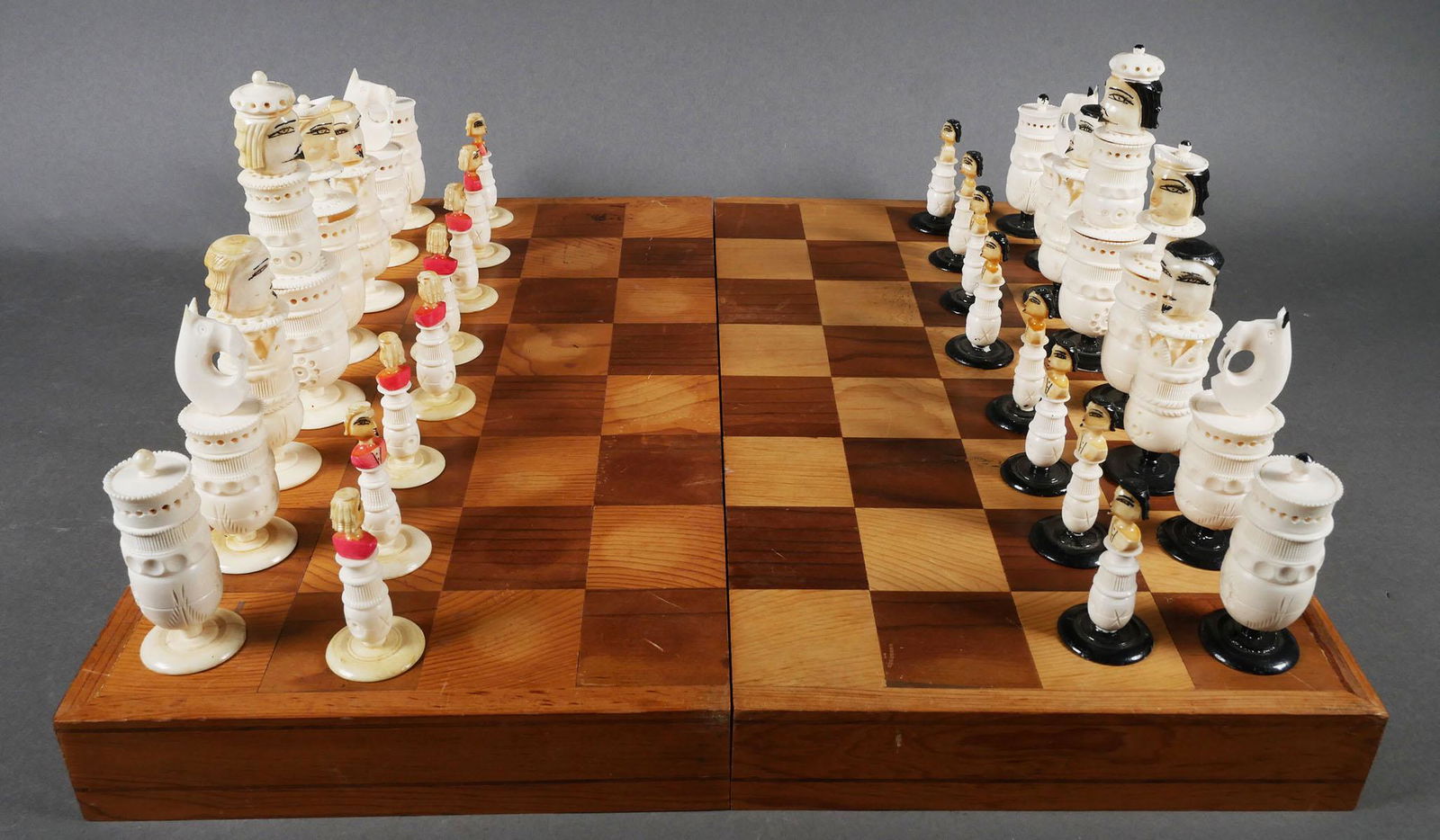 Vintage Mexican Carved Bone Chess Set: Hand carved chess set constructed of bone with painted details, various sizes, in wooden box. This item will need to be shipped by a packing company of your choice. We maintain a list of reliable ship