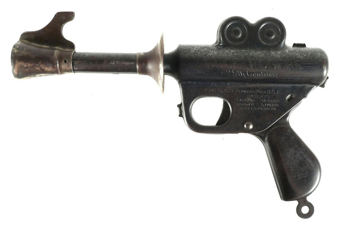 Buck Rogers 25th C Ray Gun Toy: Toy pop gun, 1930s, Buck Rogers 25th Century Ray gun, Daisy Mfg, measures 9 3/4 inches in length. This item will need to be shipped by a packing company of your choice. We maintain a list of reliable 