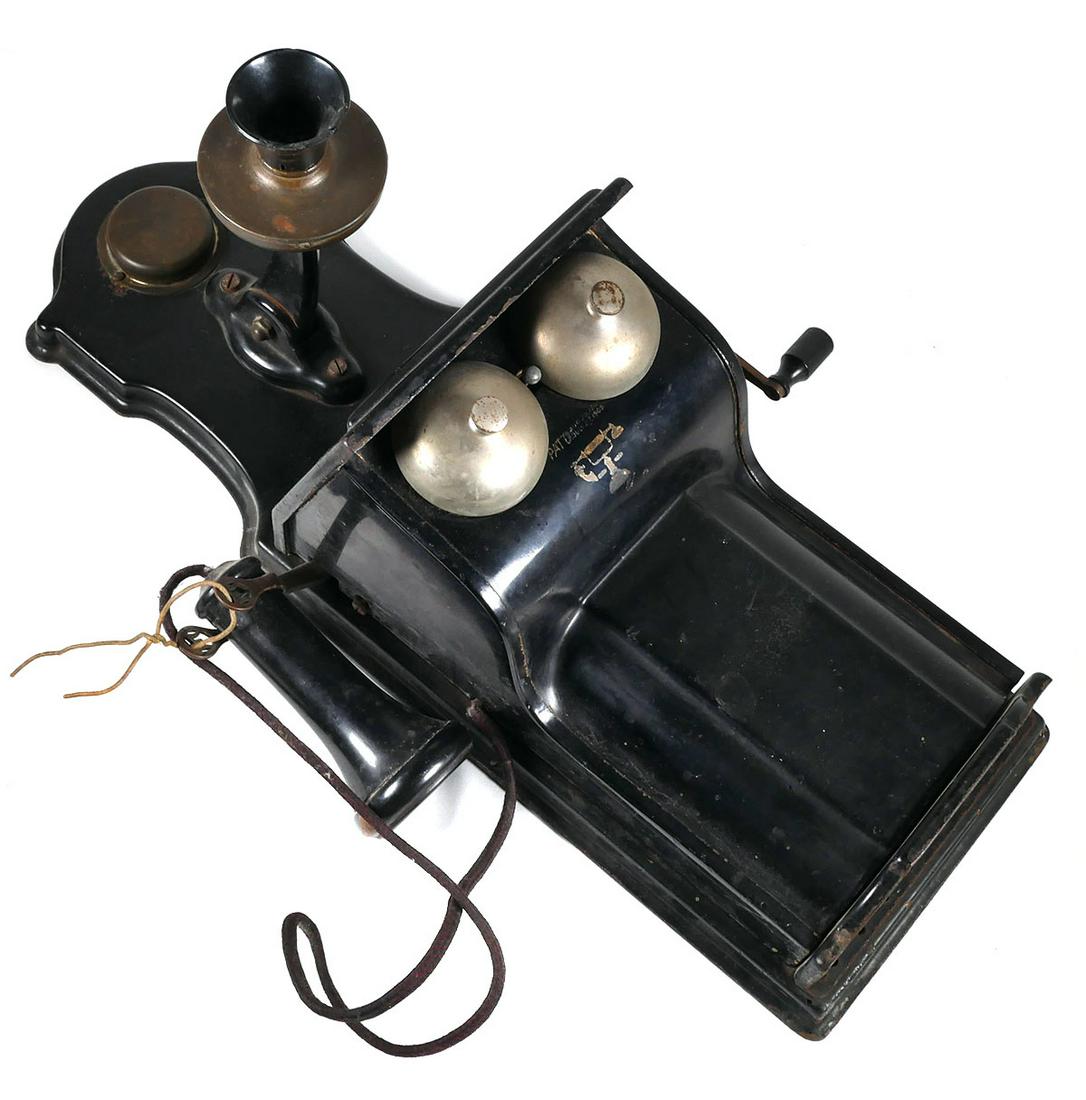 Antique L.M. Ericsson Fiddleback Wall Telephone: Ericsson Fiddle-back wall phone. Turning magneto crank rings the bells. Pat'd date 1909 under bells, Phone measures approx. 22" long x 12" wide x 9" deep. This item will need to be shipped by a packin