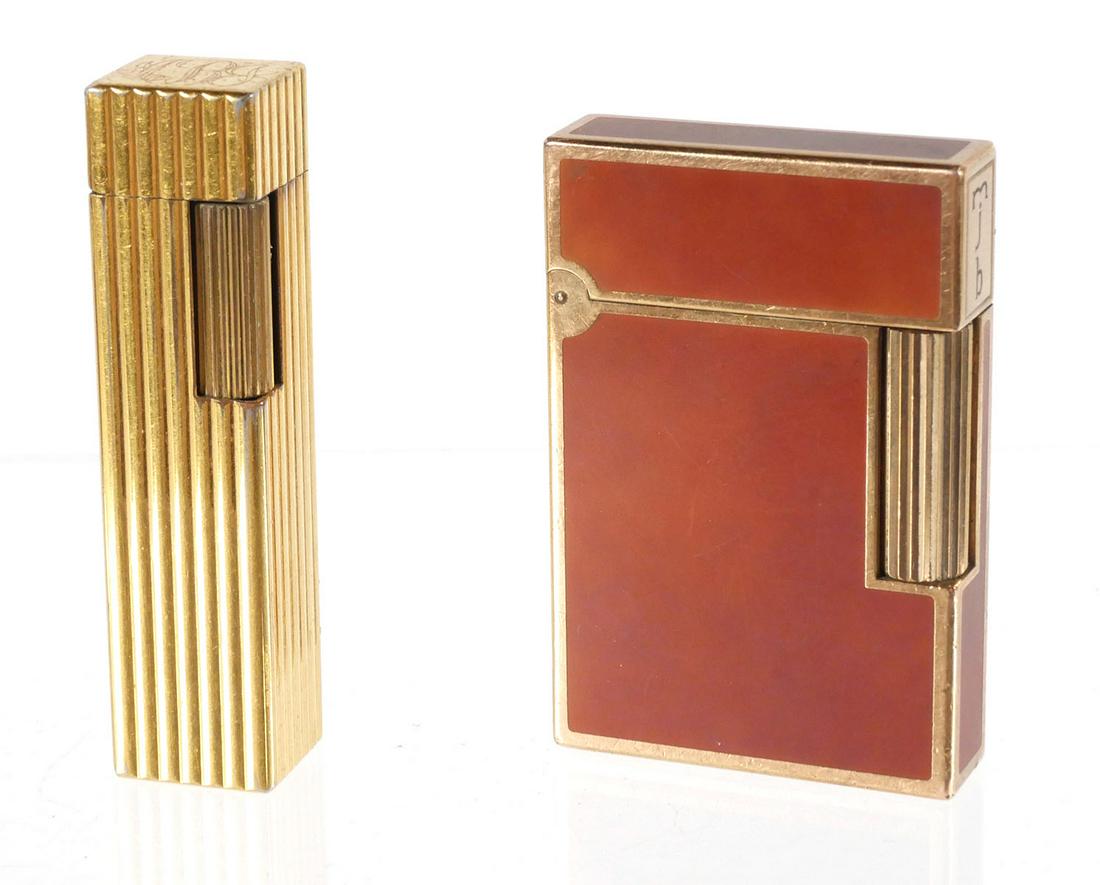 Two Vintage Dupont and Cartier Lighters: Two vintage lighters, French S T. Dupont Chinese Lacquer and gold fill lighter ser. 83JVY37 monographed mjb, and Cartier Japan monogrammed MJB, measures 2 1/2 inches tall. This item can be shipped in-