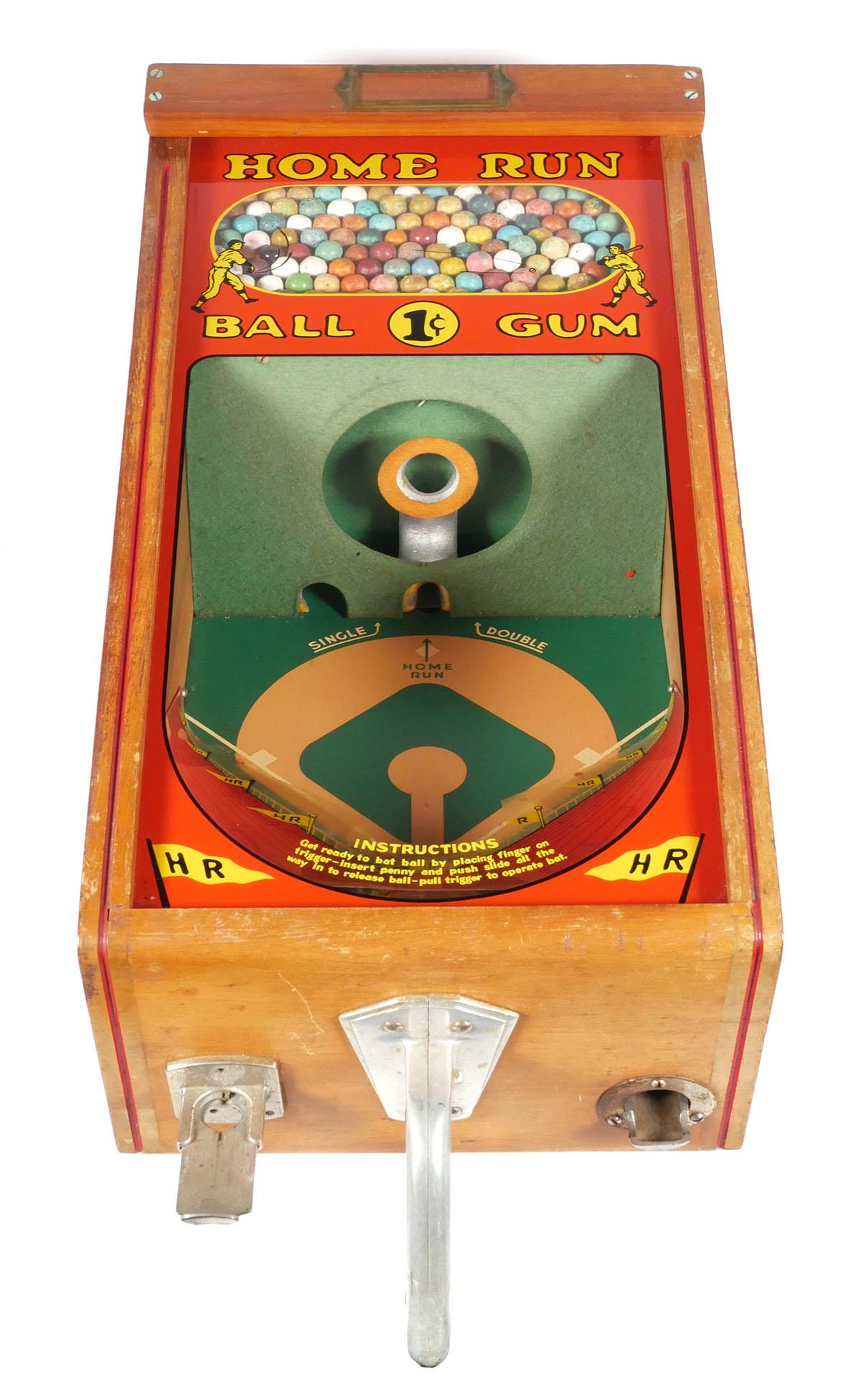 Early Baseball Toy Vending Machine by Victor: 1930s-40s Victor Vending Corp. Home Run Ball Gum game machine. Wood cabinet with cast metal. Graphics on glass with batters, interior baseball diamond. Approx. 26" L x 10-3/4" W x 14-1/2" H. This item