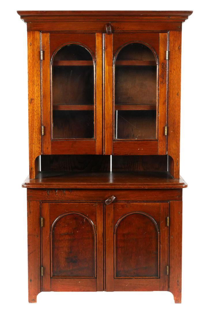 Late 19th C. Child's Stepback Cupboard: Miniature toy doll furniture stepback cabinet. Glazed upper cabinet over an open work space and double blind doors. Overall approx. 13-7/8" L x 7-1/2" W x 24-3/4" H. This item will need to be shipped 
