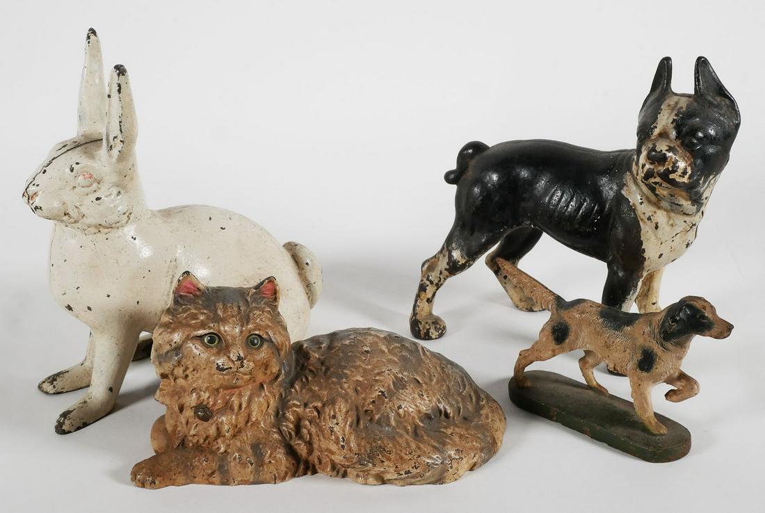 Four Antique Cast Irons Animals: Lot of Four (4) cast iron animals, featuring a Cat, Setter Dog (possibly Hubley bookend #363), Boston Terrier doorstop (reproduction, similar to Hubley model #331), and Rabbit, the tallest is 11 inche