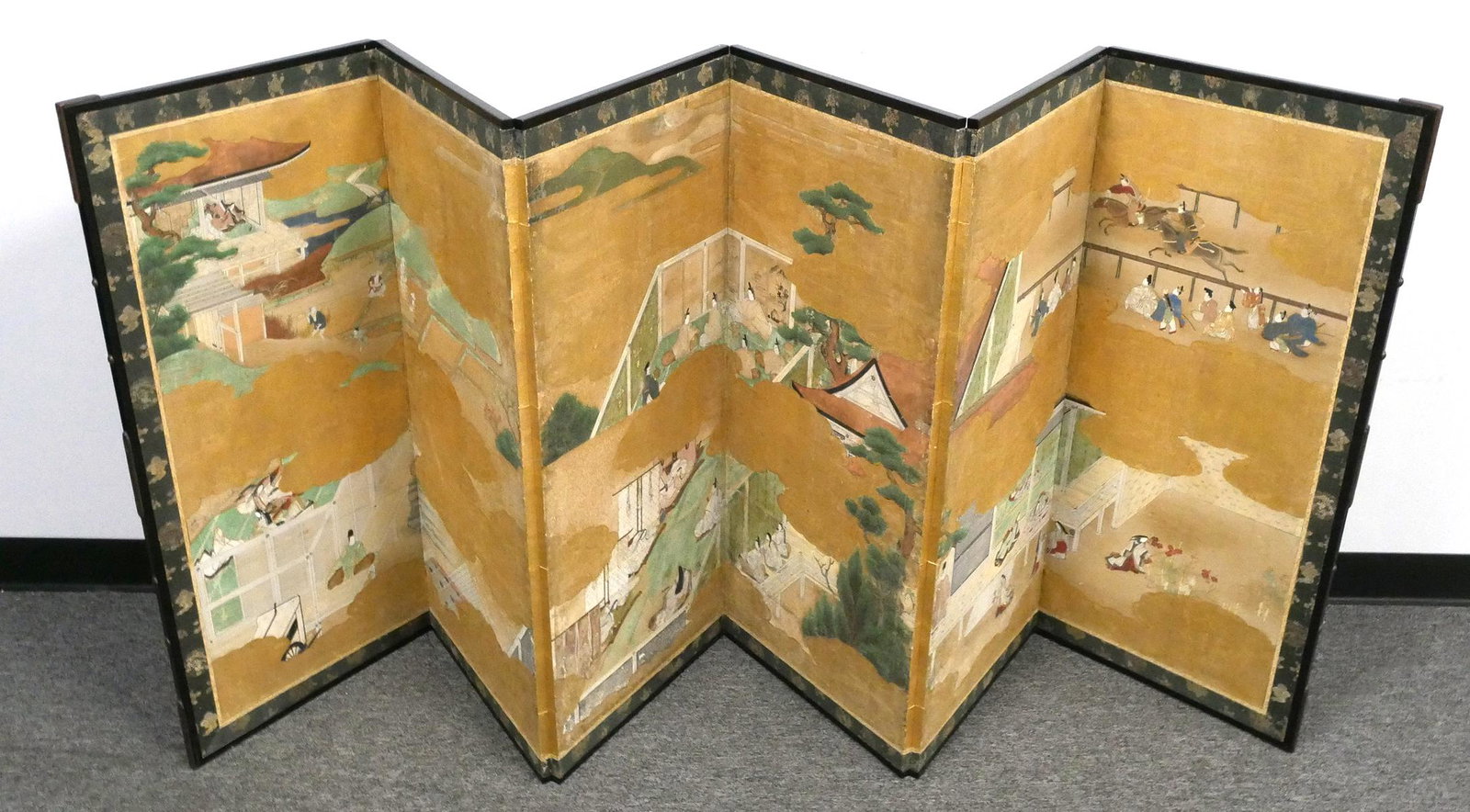 Edo Period Japanese Screen Tales of Genji: Large six panel folding screen representing scenes from the Tales of Genji, Japanese, Edo period; ink, color and gold on paper surrounded by silk fabric. Each panel measures 40 3/4" x 18" (HW), full d