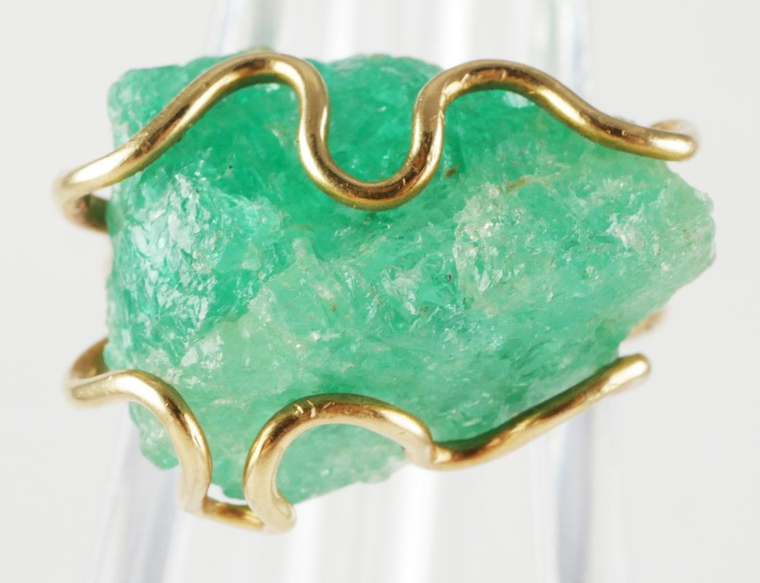18K Yellow Gold w Large Rough Emerald Ring: Vintage Modernist 18K yellow gold setting with rough uncut emerald in a wire wrap bezel, stone measures 18 x 14mm. Ring size 5 3/4, marked 18K, total weight 6.1g. This item can be shipped in-house.