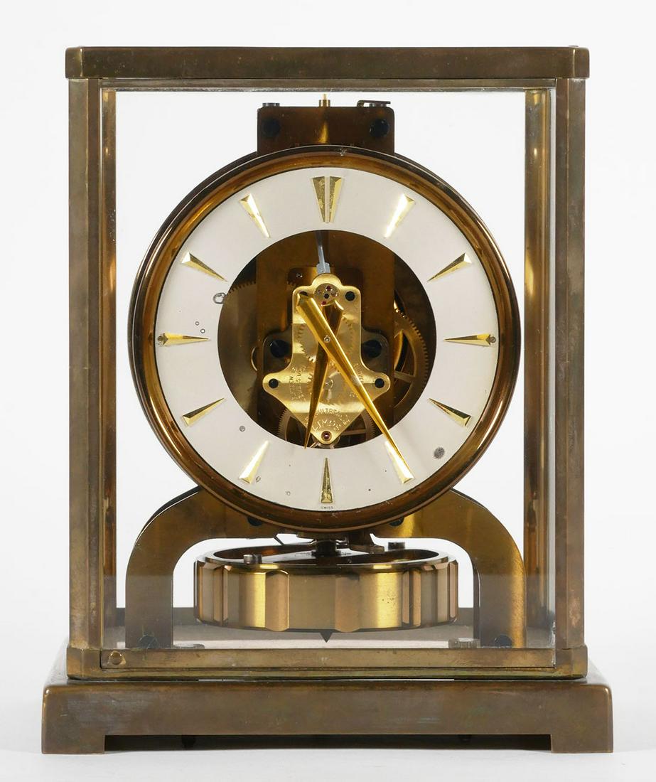 Vintage Atmos Jaeger Le Coultre Mantle Clock: Swiss Made glass and brass mantle clock by Jaeger Le Coultre, serial no. 77519, caliber 526-5, measures 8 3/4 x 7 1/4 x 5 1/4 inches. This item will need to be shipped by a packing company of your cho