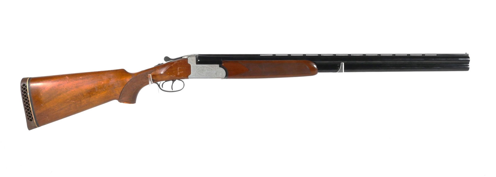 ZOLI Italian Over Under Shotgun 12 Ga Magnum: Antionio Zoli O/U break action shotgun chambered for 12 gauge 3" Magnum shells. Vent rib barrel measures approx. 28", 45 1/2" overall, 14 3/4" LOP. Barrels are marked * (full) and *** (modified) choke