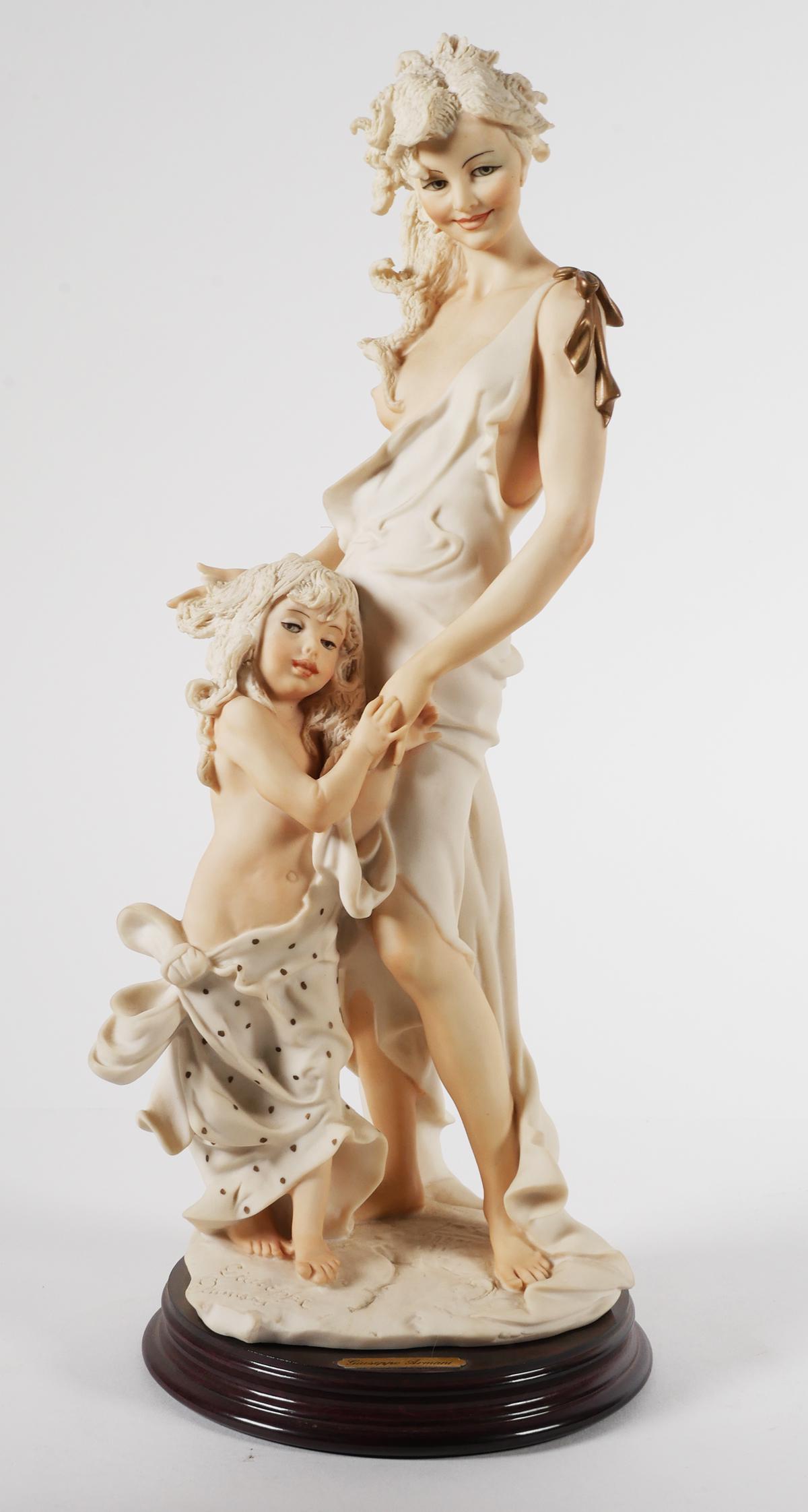Giuseppe Armani Figurine 1254C HEART AND SOUL: Giuseppe Armani porcelain figurine titled "Heart and Soul". It stands 12 3/4" and is a limited edition #780/5000. Comes with the original box. This item will need to be shipped by a packing company of