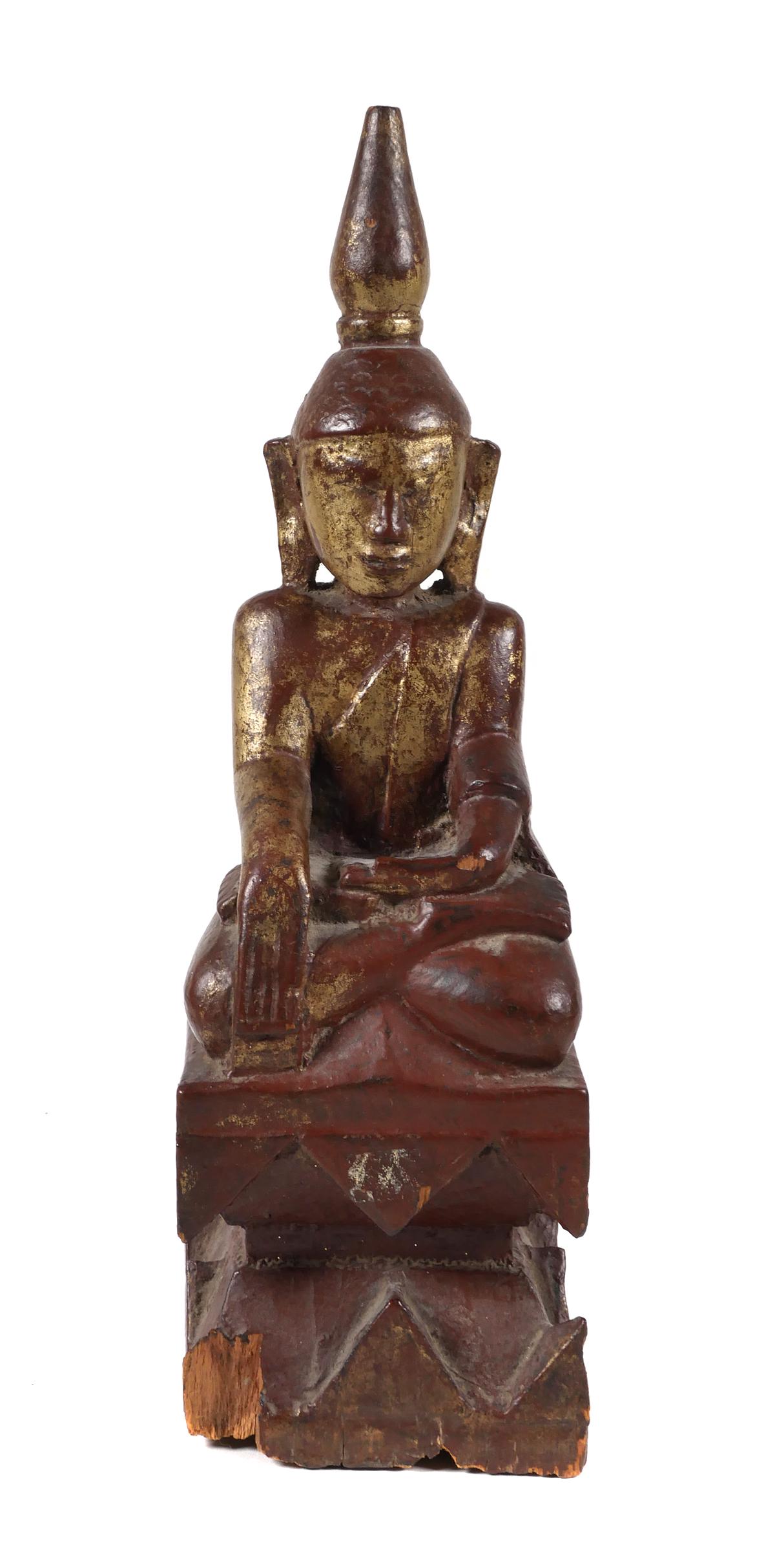 Antique Burmese Buddha Possibly 17th C.: Hand Carved and painted Burmese Thailand Temple Buddha in the Bhumisparsa Mudra posture modelled seated on a carved plinth. Painted with traces of gilt. Old shop label reads "Antique Hand Carved Wood 