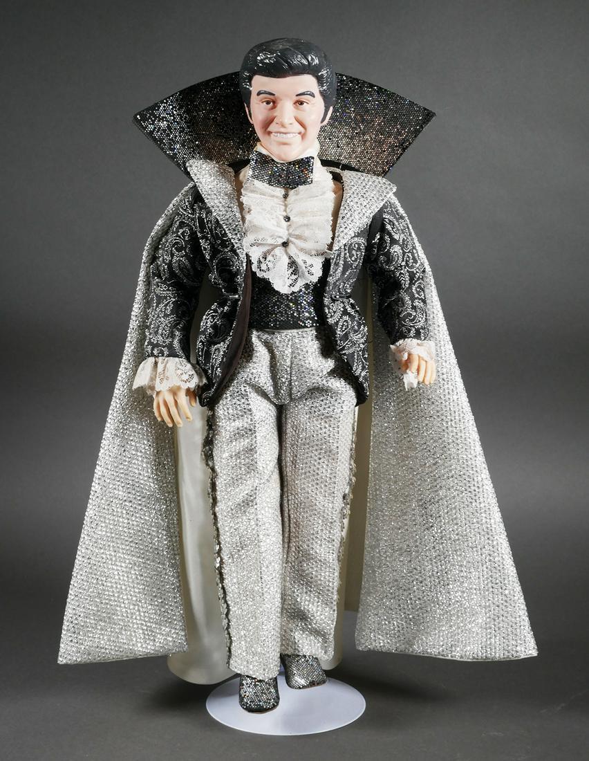 LIBERACE ESTATE: Effanbee Doll: 1986 Effanbee Liberace Doll, all vinyl, dressed in evening performance attire. Sold as lot number 989 in the 1988 Christie's auction of the Liberace Collection and pictured on page 117 of the catalog.