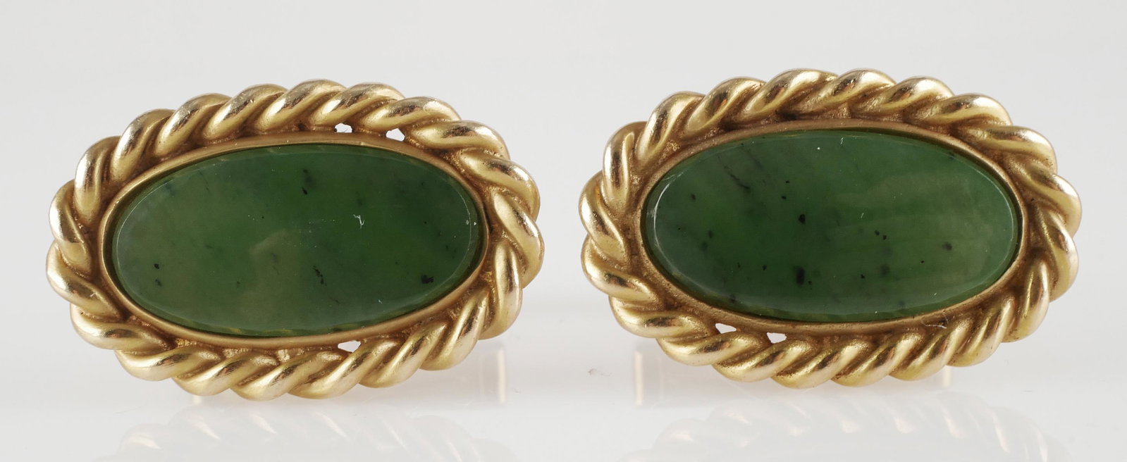 14k Gold Jade Cufflinks: Jade center stone with rope border. Face approx 5/8"H x 3"L., 13.4 g total. This item can be shipped in-house.