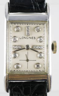 LONGINES Diamond 14k Art Deco Watch: Vintage early 20 Century Art Deco Swiss made watch. 14 karat white gold rectangular case, manual wind movement. Silver tone matte dial accented with diamonds set into each hour marker. Winds and runs