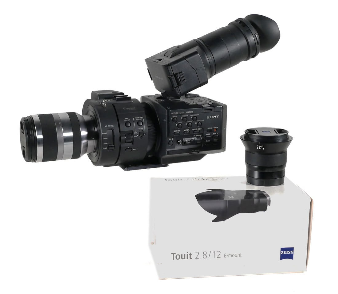 Sony Exmor Super35 CMOS Camera, 2 Lenses: Sony FS700 high-end video camcorder, with Sony 18-200mm zoom lens and Zeiss Touit 12mm wide angle lens in original box. Comes with accessories as shown, as well as Petrol rolling camera bag. From the