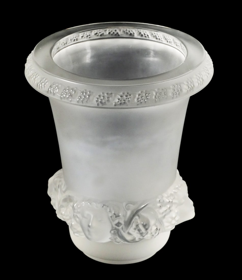 LALIQUE Post-War Quatre Tete Femmes Vase: Lalique signed, circa 1950. Four women's faces in high relief along bottom. Measures about 5-1/2" high. One of a few early Lalique art glass pieces in today's sale. This item can be shipped in-house.