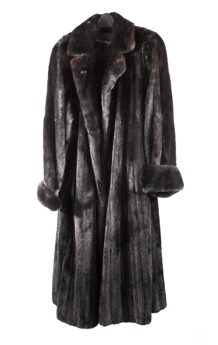 Goldin Feldman Mink Coat, Full Length: Full length mink fur coat. Interior tie with loop on opposite side, turn back cuffs and a two point fold back collar. Two hidden hook closures. Very dark brown. Maker's label for Goldin Feldman. Appro