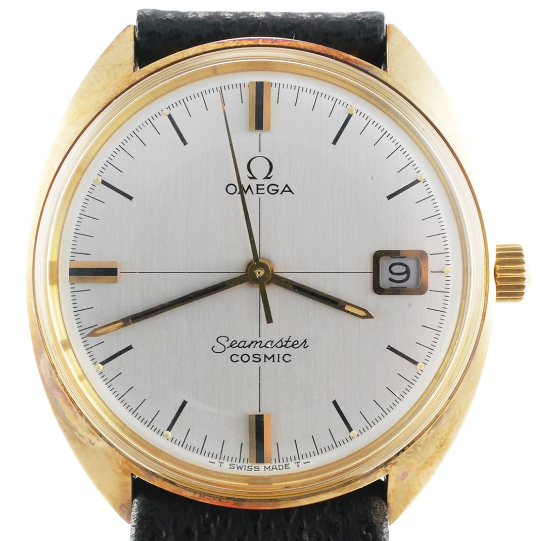 OMEGA SEAMASTER Cosmic Wristwatch: Vintage Omega Cosmic Seamaster watch. Hand wind mechanical movement. Date feature. 18K gold filled one piece case. Case measures approx. 35mm, 19mm lug width. #136.017 SP. Omega band and Omega marked