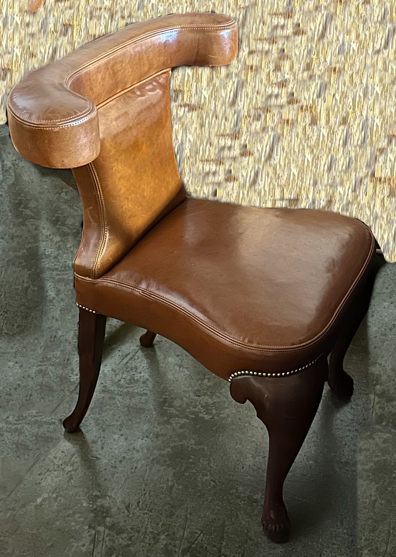 Modern Equestrian Dining Chair: This dramatic piece adapted from a 19th century English sporting chair has a yolk-back design, saddle stitching details and Queen Anne legs with horse-hoof feet. W28 1/4" X D24 3/4" X H35". This item 