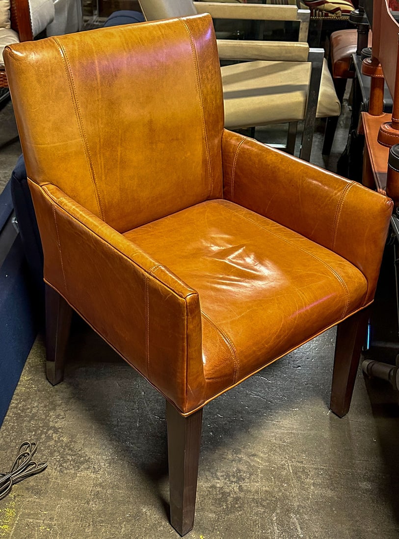 Ralph Lauren Modern Metropolis Dining Arm Chair: A contemporary styled chair with rosewood legs. Dimensions 23"W x 24"D x 36"H. This item will need to be shipped by a packing company of your choice. We maintain a list of reliable shippers, or you ma