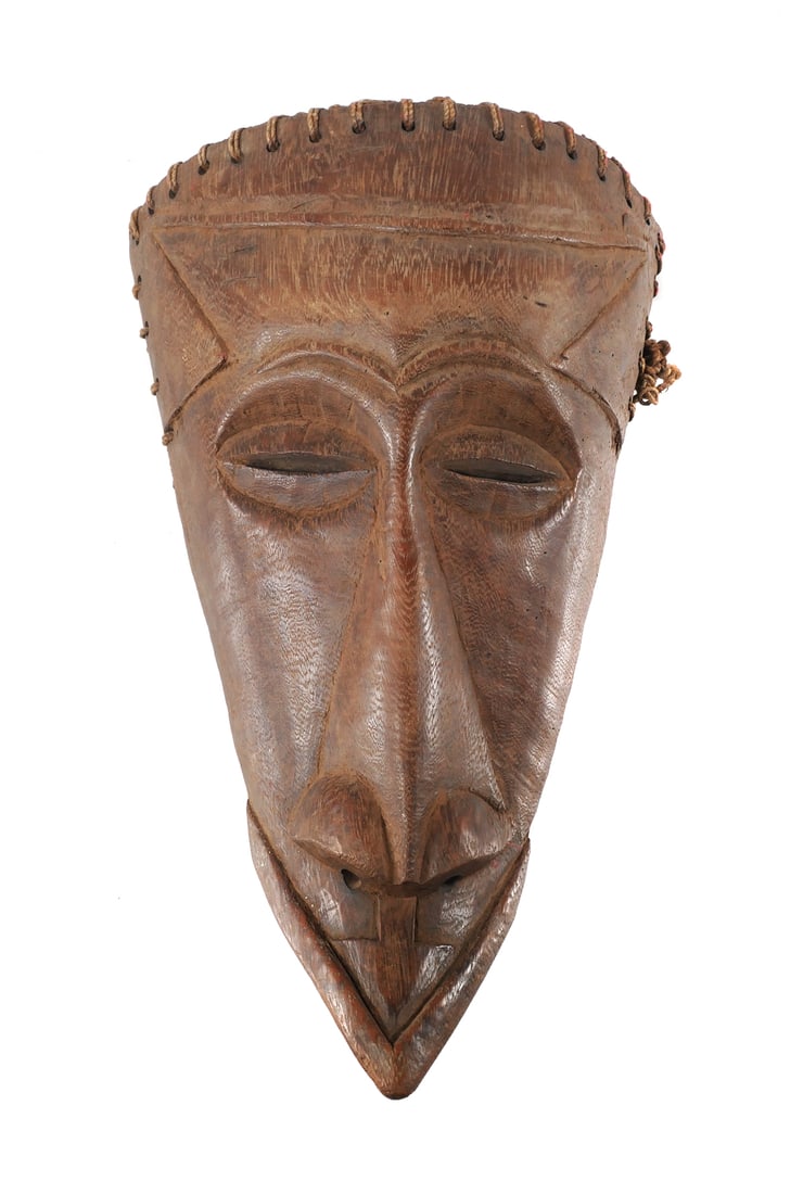 KUBA NEGEENDE ELONGATED MASK: African hand carved wood mask in the form of an elongated stylized face. Back of the mask has a knotted fiber coiffure. Central Africa, Democratic Republic of Congo DRC Approx. 18"H. This item will ne