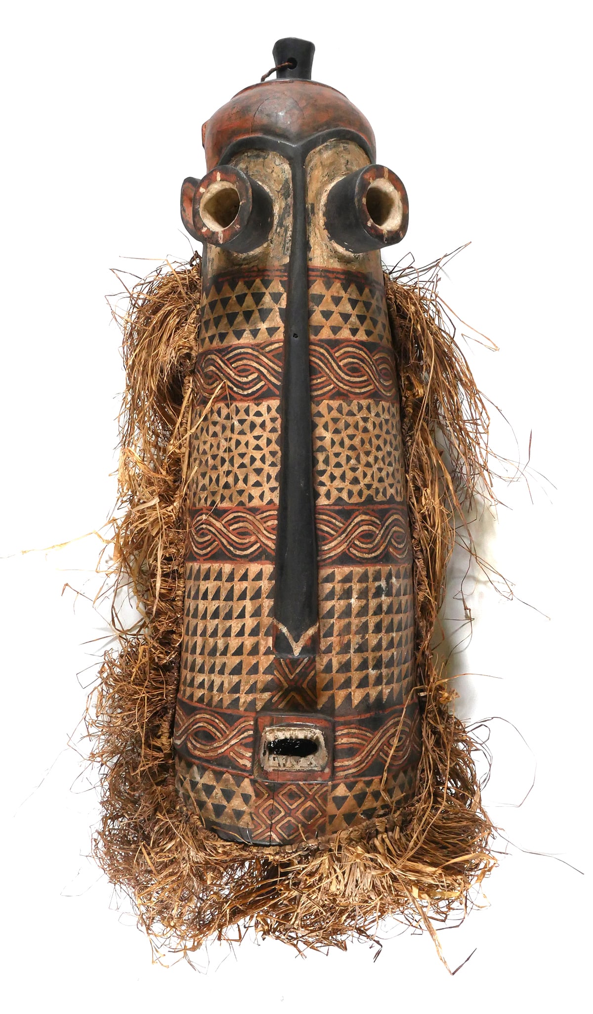 YORUBA FESTIVAL MASK: African carved wood mask, Nigeria Yoruba peoples gelede festival of masks, or Eastern Pende peoples pende / phumbu / pumbu mask. Textile and wood, having a tag with a deaccession number. Approx. 33-1/