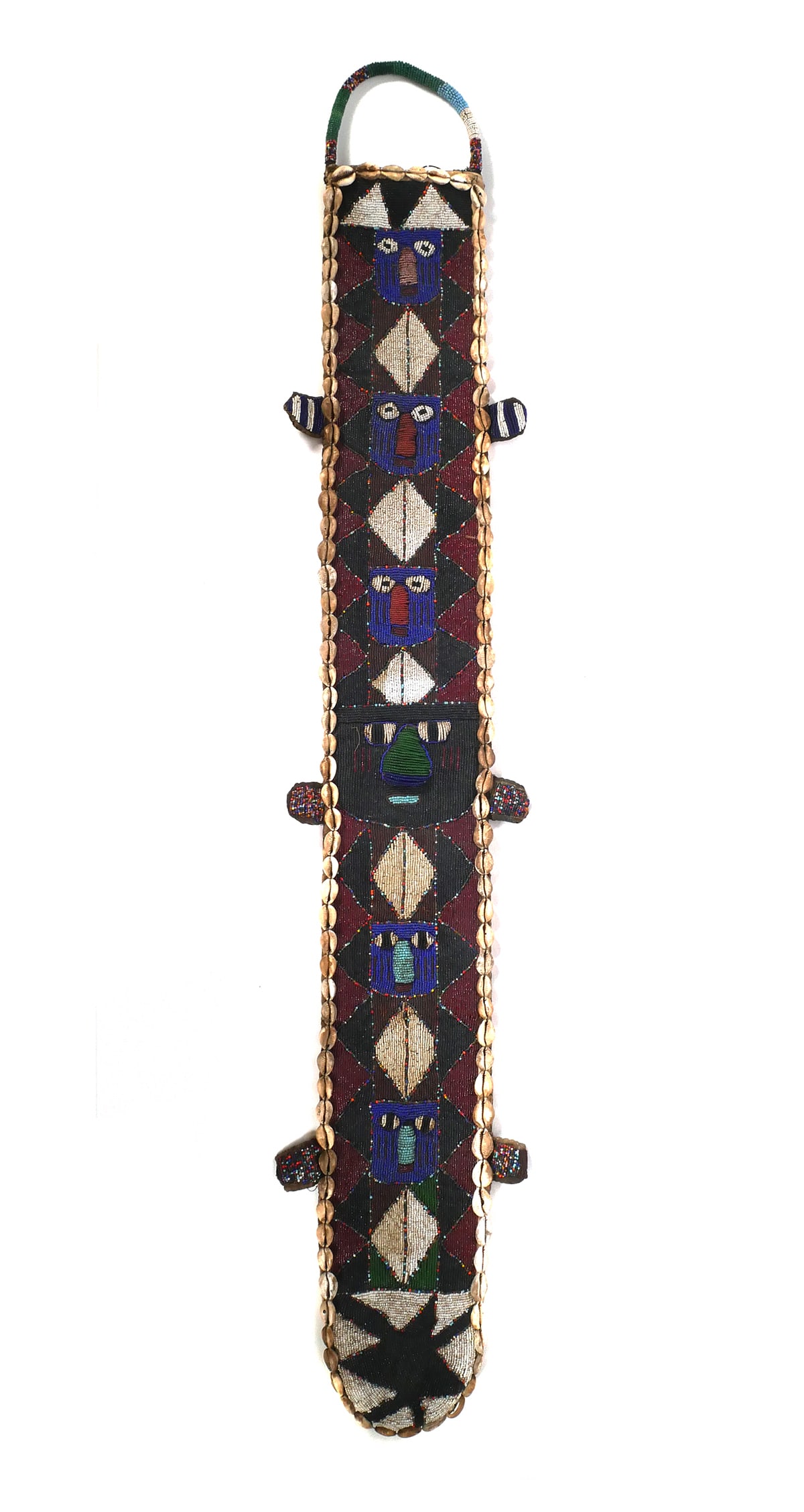 YORUBA BEADED SASH: Beaded ceremonial sash decorated with cowrie shells and backed by Asho Oke cloth. Yoruba peoples of West Africa. Approx. 52-1/2"L x 7-1/2"W x 9" at widest point. This item will need to be shipped by a
