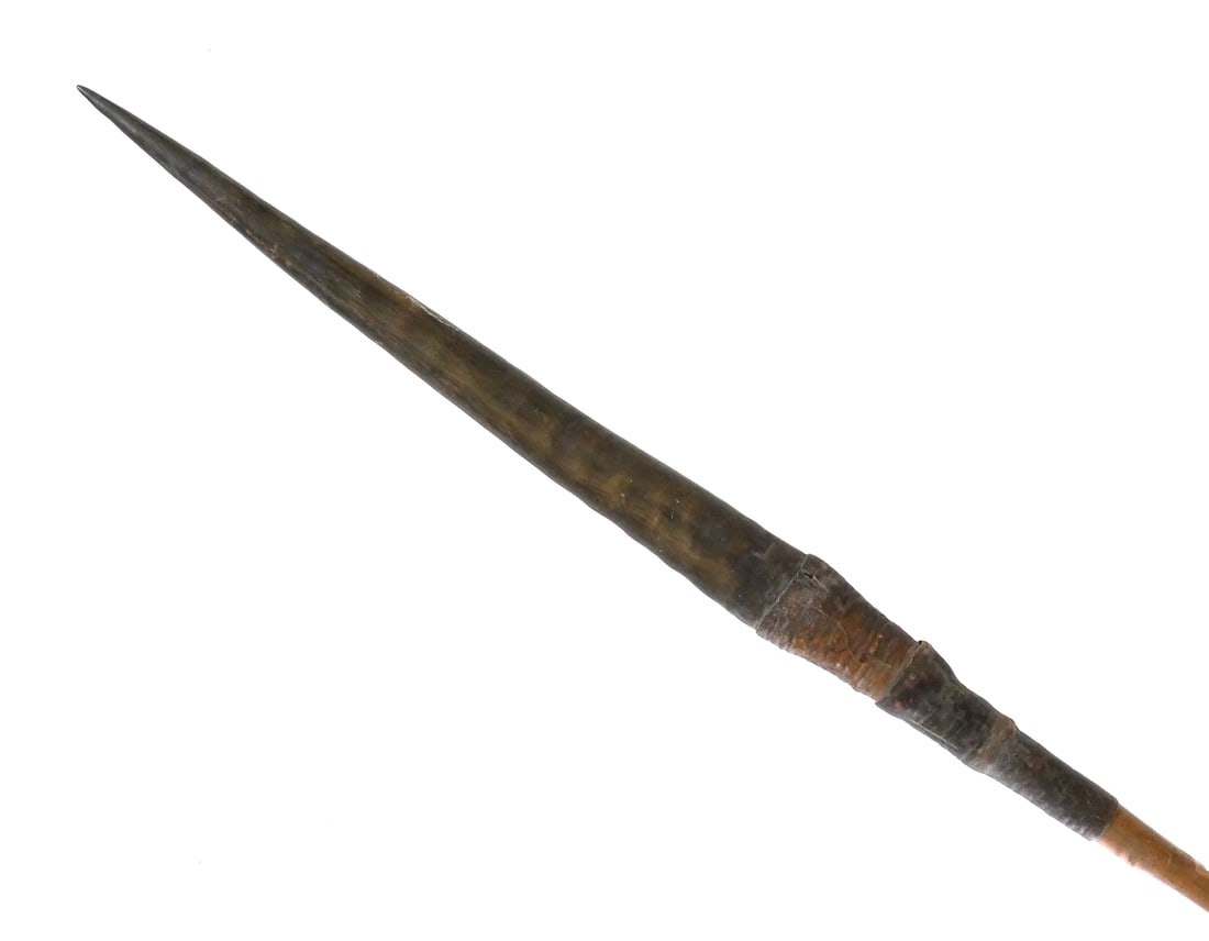 UNYORO CENTRAL AFRICAN HORN SPEAR: Collected by early English explorers, the haft lettered in classic white ink and fine Victorian hand, "UNYORO". Approx. 6'-4" overall. Tapered haft with wound iron base weight and double Zulu style se
